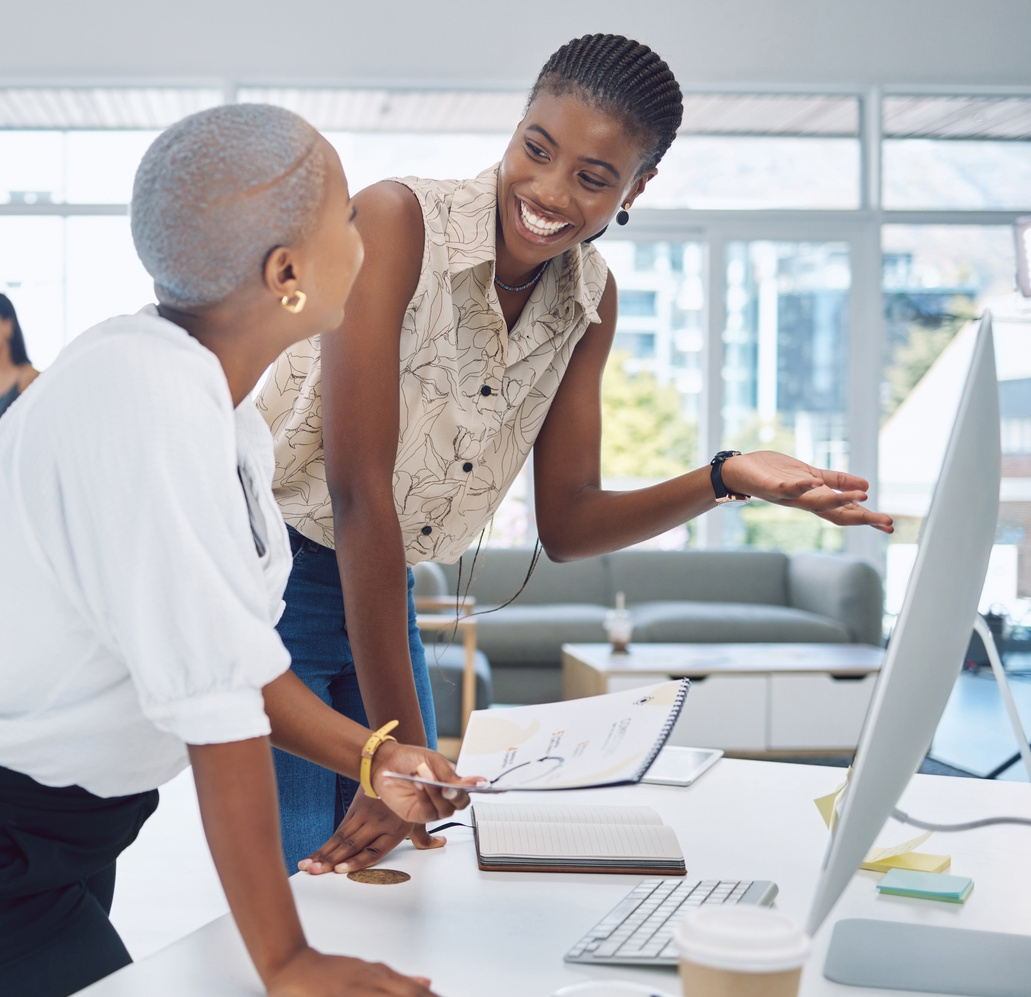 Black Woman, Desk Collaboration and Corporate Company Relationship at Office with Coworkers. African American Worker People in Business Communication and Talk for Report Proposal Criteria.